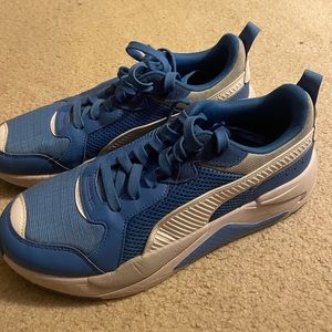 Puma brand shoe, Men’s size 10, colors are white, blue, and a little bit of grey
